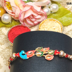 Antiquepeacock stone studded Metal Rakhi